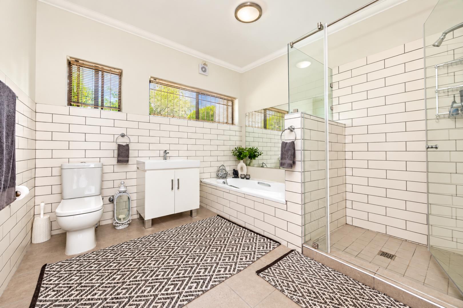 768744_Bright_Modern_Bathroom_with_Glass_Shower.png