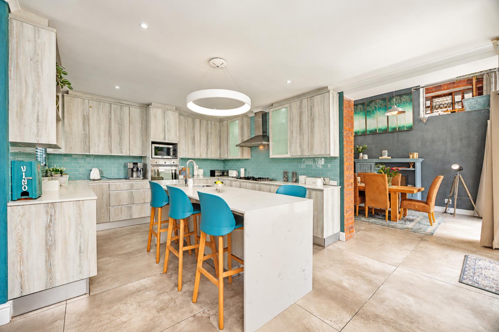 768744_Contemporary_Teal-Accented_Kitchen_Dining_Space.png