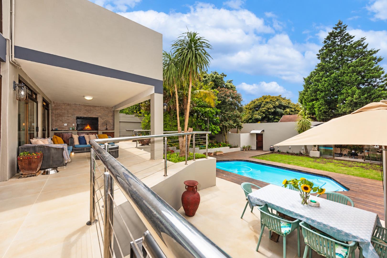768744_Luxurious_Poolside_Patio_with_Fireplace.png
