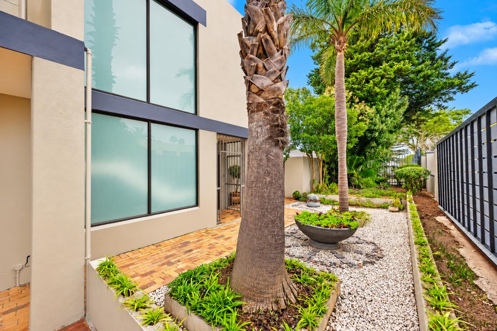 768744_Modern_Home_Courtyard_with_Palm_Landscaping.png