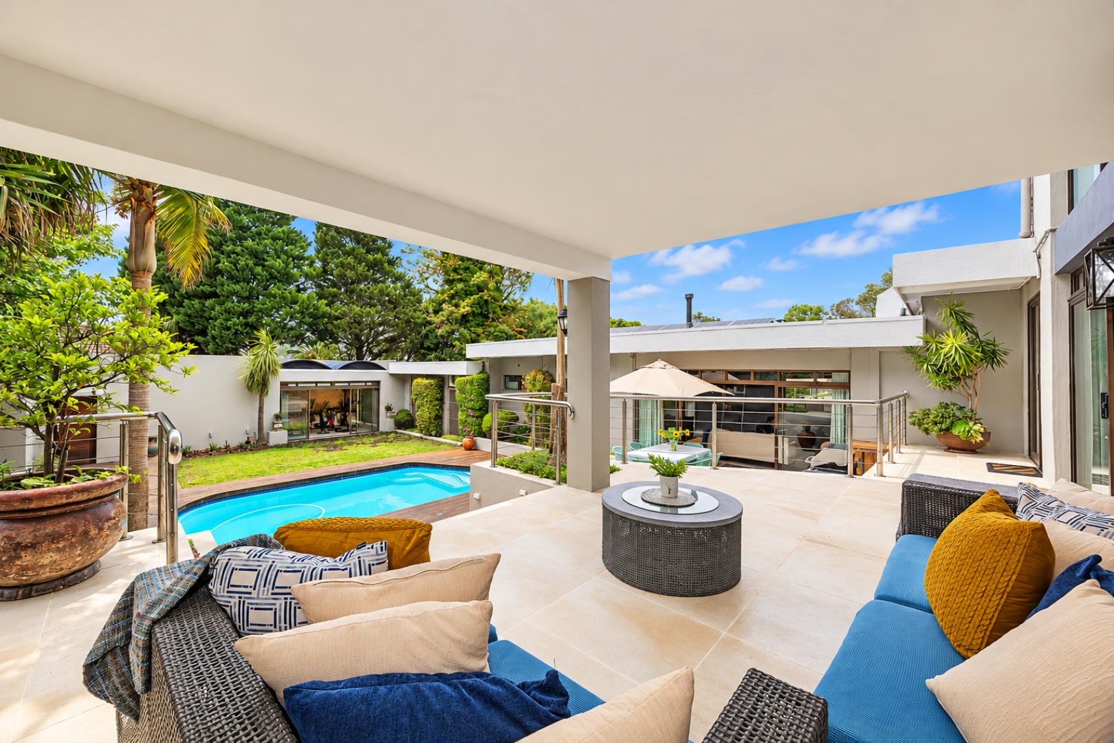 768744_Sunlit_Modern_Patio_Overlooking_Pool.png