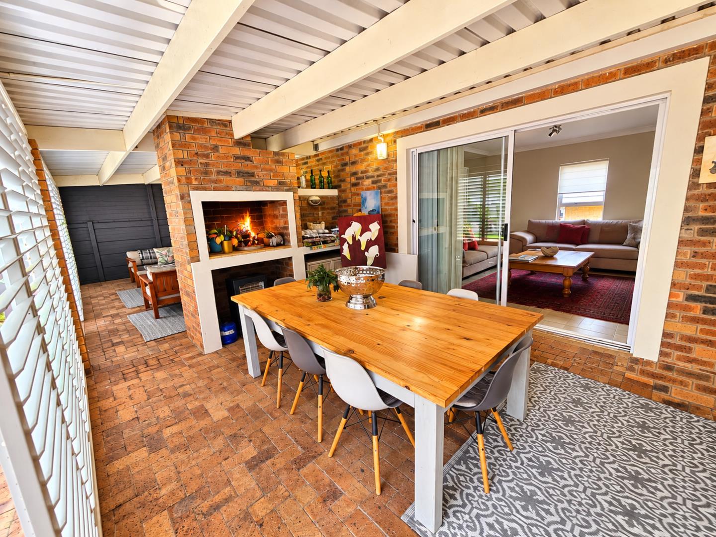 769386_z.__Rustic_Patio_with_Fireplace_and_Dining_Table.png