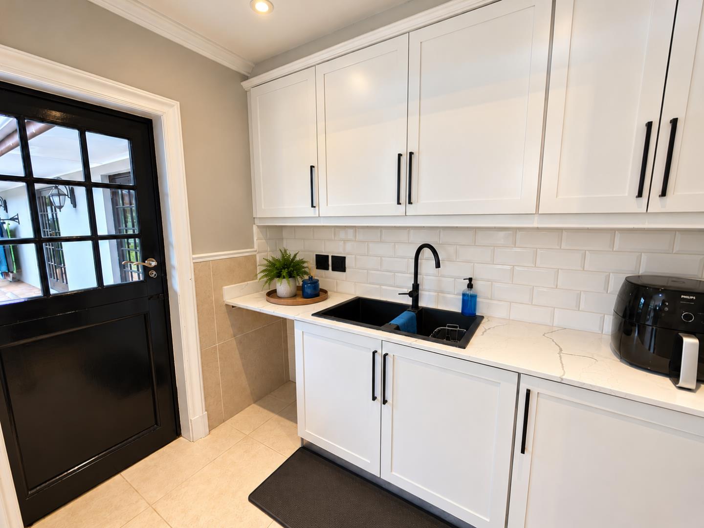 769572_Modern_Greige_Utility_Kitchen_with_Black_Accents.png