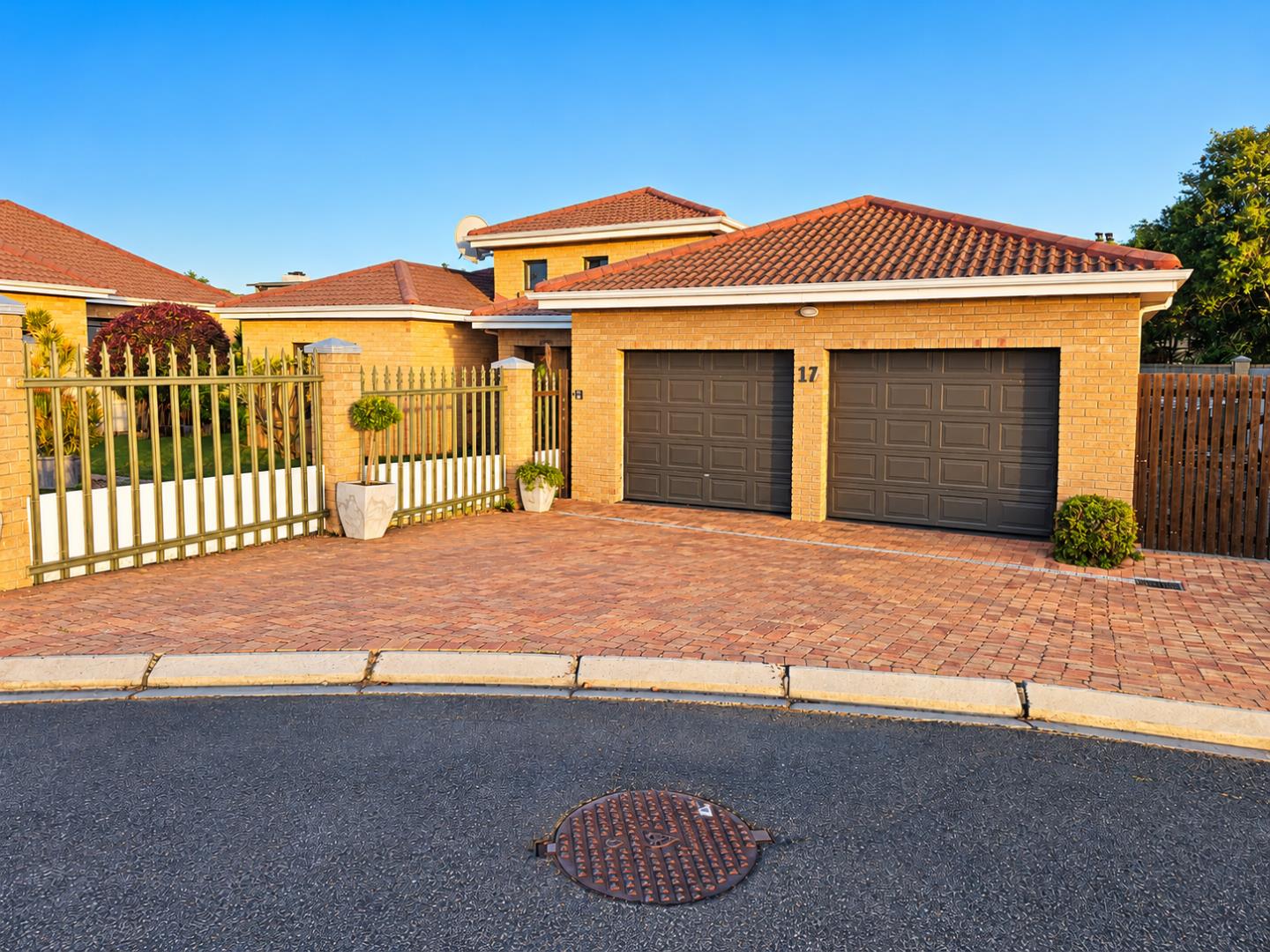 769601_Sunlit_Suburban_Home_and_Garage.png