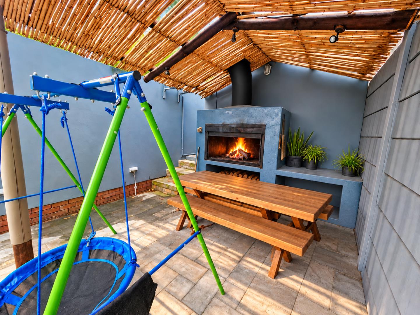 769784_Bamboo_Patio_with_Fireplace_and_Swing.png