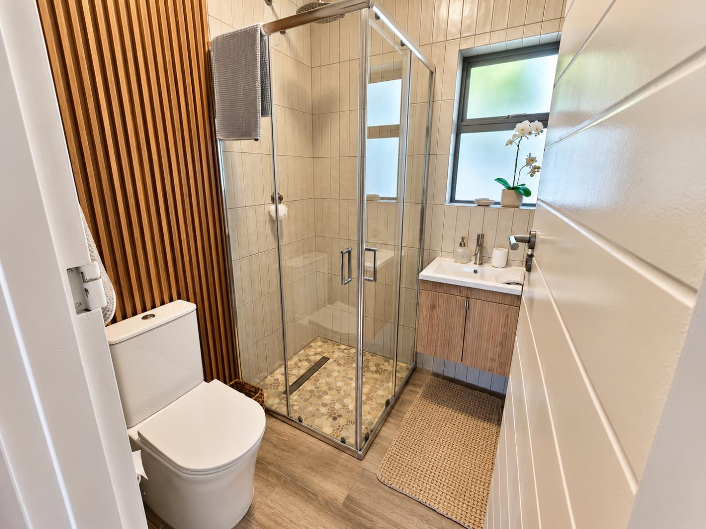 769820_Bright_Modern_Bathroom_with_Glass_Shower.png