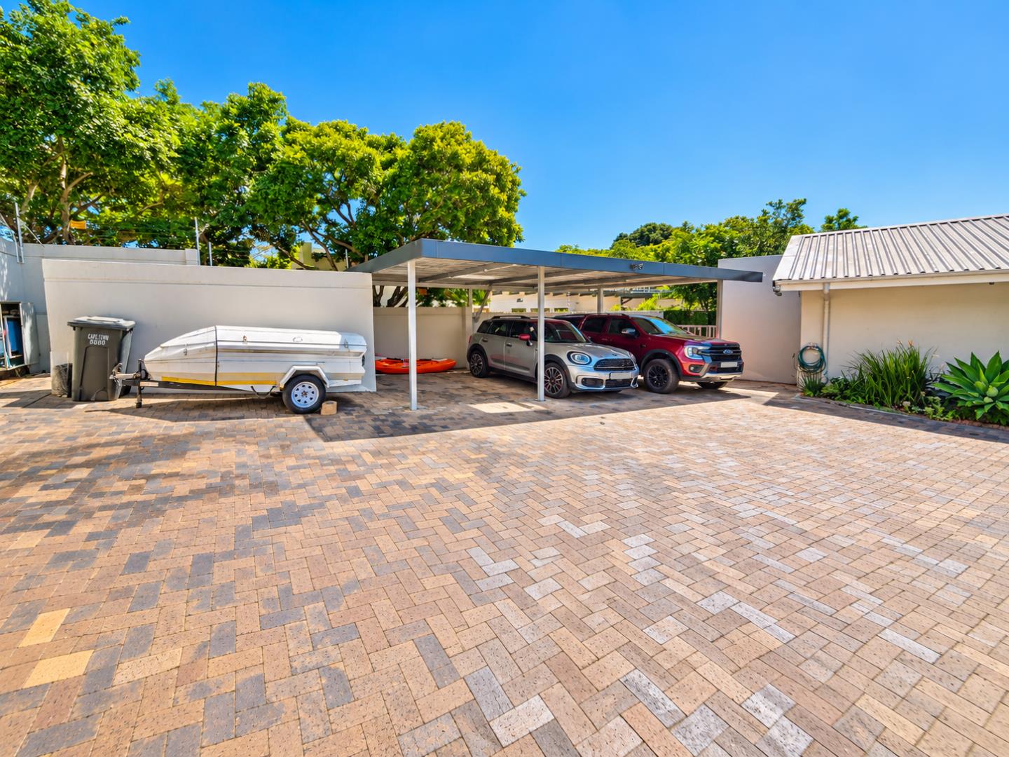 769820_Sunlit_Driveway_with_Modern_Carport.png