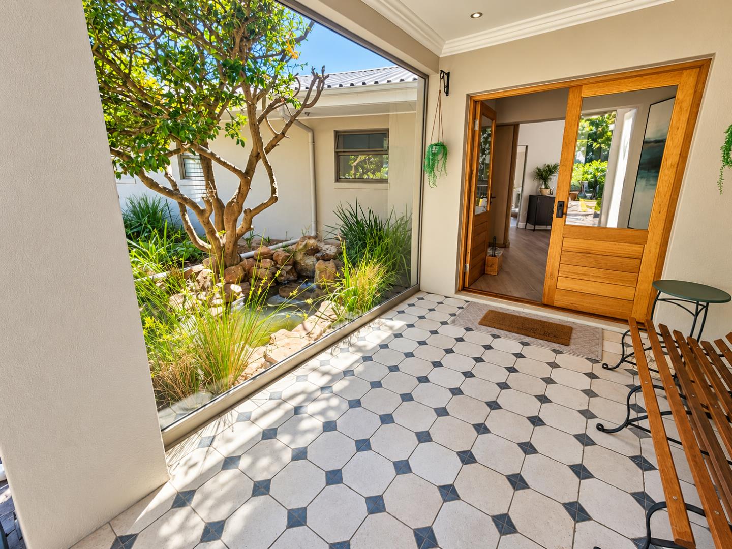 769820_Sunlit_Modern_Courtyard_Entrance.png