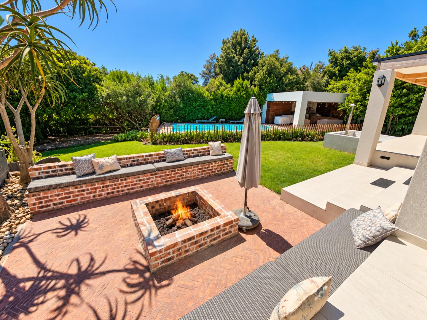 769820_Sunny_Backyard_Patio_with_Pool_and_Fire_Pit.png